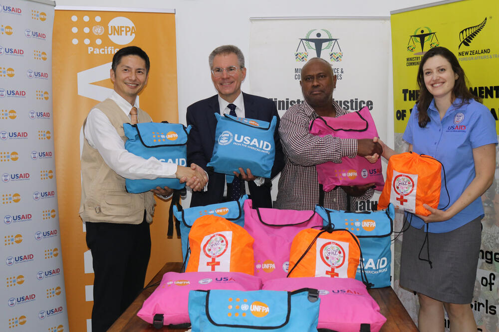 UNFPA Pacific, with the generous funding support of USAID Bureau of Humanitarian Assistance, handed over “Dignity Kits” to the Vanuatu Gender and Protection Cluster Coordinator, the Ministry of Justice and Community Services, to be ‘pre-positioned’ in cyclone-prone outer islands. 13 August 2024, Port Vila (From left to right: Mr. Iori Kato, UNFPA Director for the Pacific Island Countries; Mr. Jeffrey Shelstad, Chargé d’Affaires a.i. of the US Embassy in Vanuatu; Mr. Arthur Faerua, Director-General of the Ministry of Justice and Community Services & Coordinator of the Gender and Protection Cluster; and, Ms. Leah Beth Miller, Humanitarian Assistance Officer, USAID-BHA, Washington D.C.) © UNFPA/Olana Naigulevu