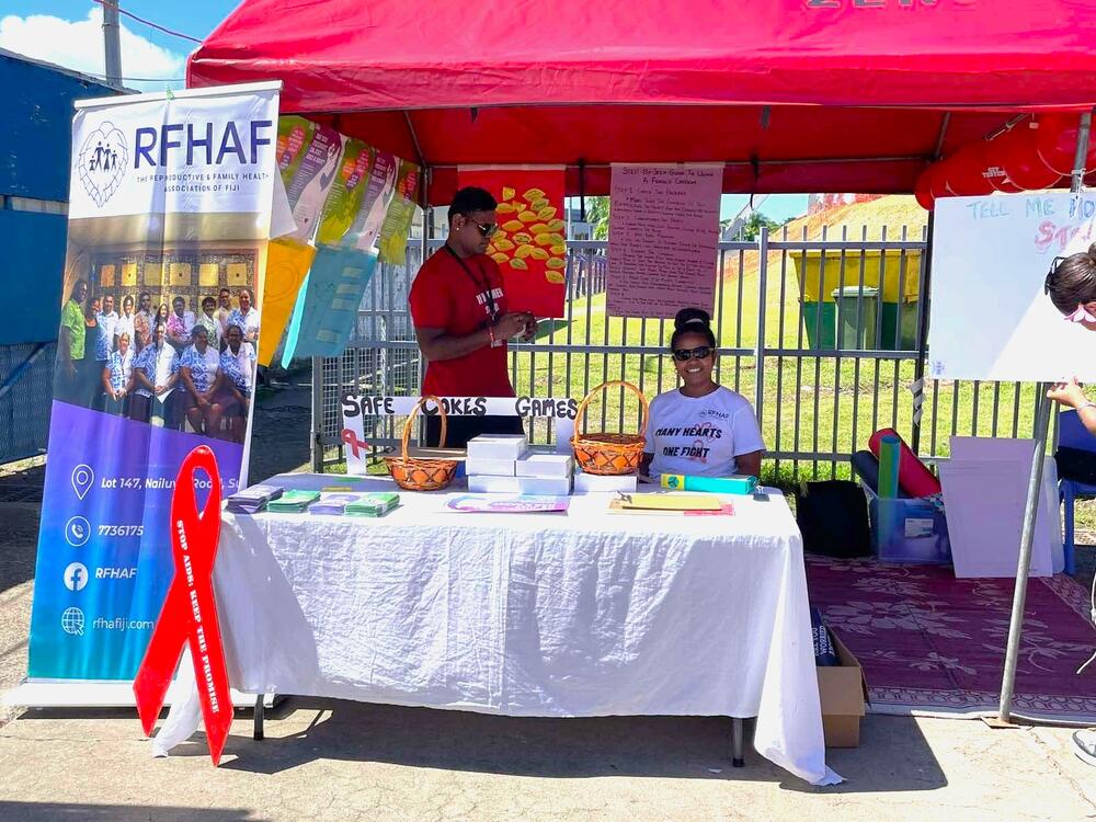 Asenaca Solinadrotini volunteers at a community HIV awareness open booth in Suva, which is designed to engage young people on safe choices, stigma reduction, and access to sexual and reproductive health services.