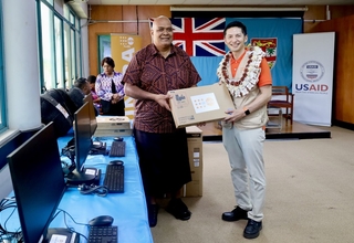 UNFPA Pacific Director, Mr. Iori Kato, handing over IT equipment to Hon. Fiji Northern Division Commissioner, Mr. Uraia Rainima.