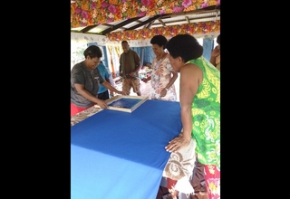 Members of the local women’s group in Korotubu village use materials provided by UNFPA to make products to sell and exhibit in t