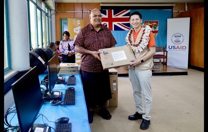 UNFPA Pacific Director, Mr. Iori Kato, handing over IT equipment to Hon. Fiji Northern Division Commissioner, Mr. Uraia Rainima.