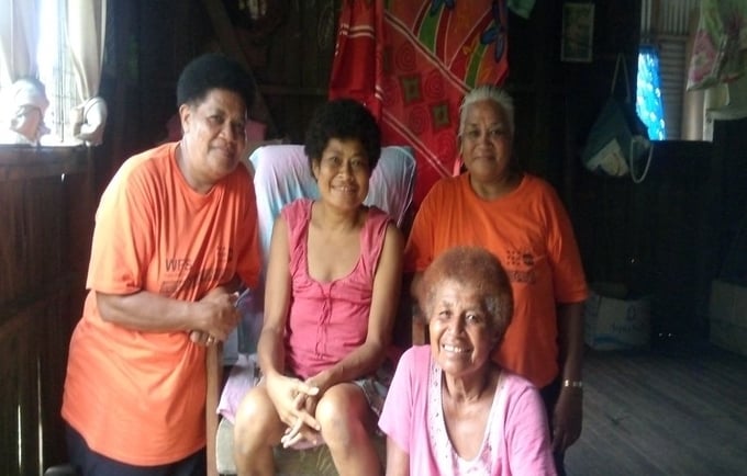 Mereia Wainisau Kotoitubuna, seated, with her mother Ana Sevu (in front) and the two retired midwives, Sr Mekita Vono and Sr Josefini Seeto.  Tukavesi, Vanua Levu. 