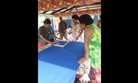 Members of the local women’s group in Korotubu village use materials provided by UNFPA to make products to sell and exhibit in t
