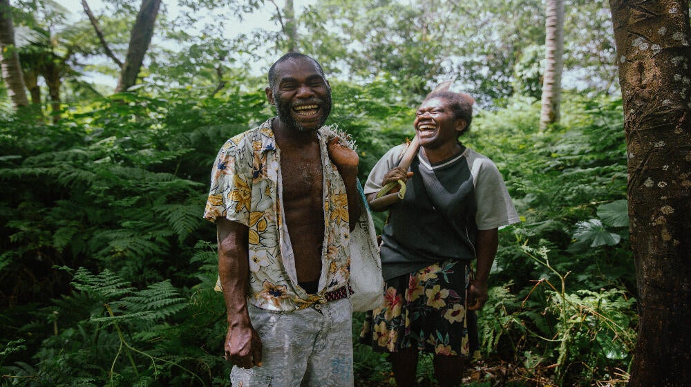 Lily Iawantak and her partner Kasi share a laugh at their village home on Tanna Island, Vanuatu. 