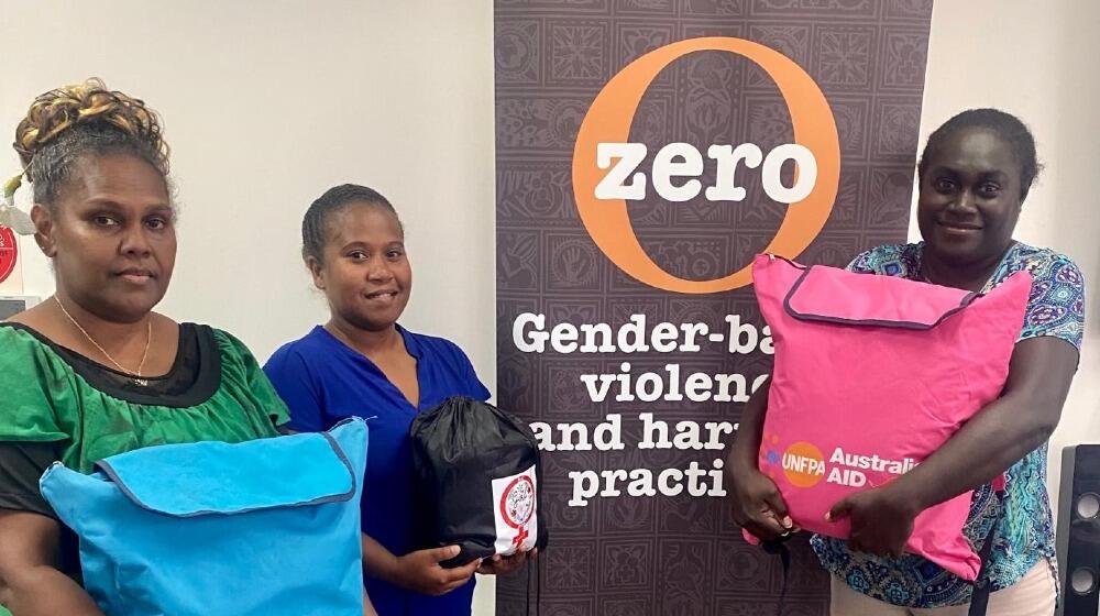 Participants of the UNFPA-supported MISP training in Honiara, the Solomon Islands, carrying Pacific-customized Dignity Kit, Wome