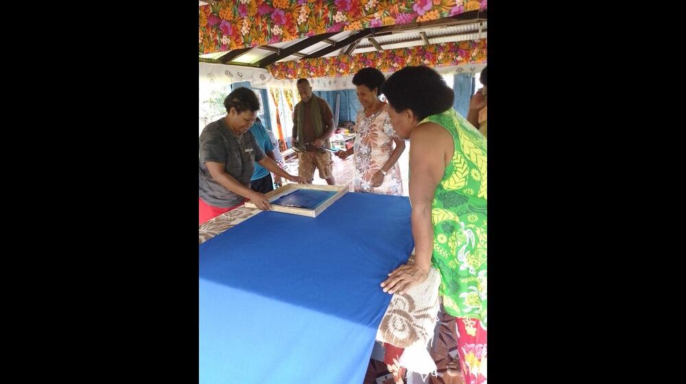 Members of the local women’s group in Korotubu village use materials provided by UNFPA to make products to sell and exhibit in t